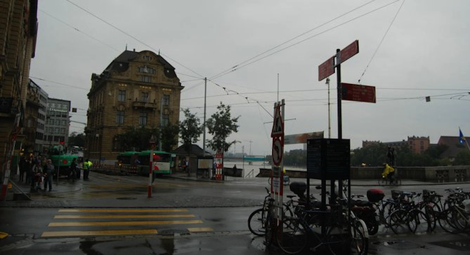Ubiquitous Swiss trams pass near the five-star Grand Hotel Les Trois Rois.