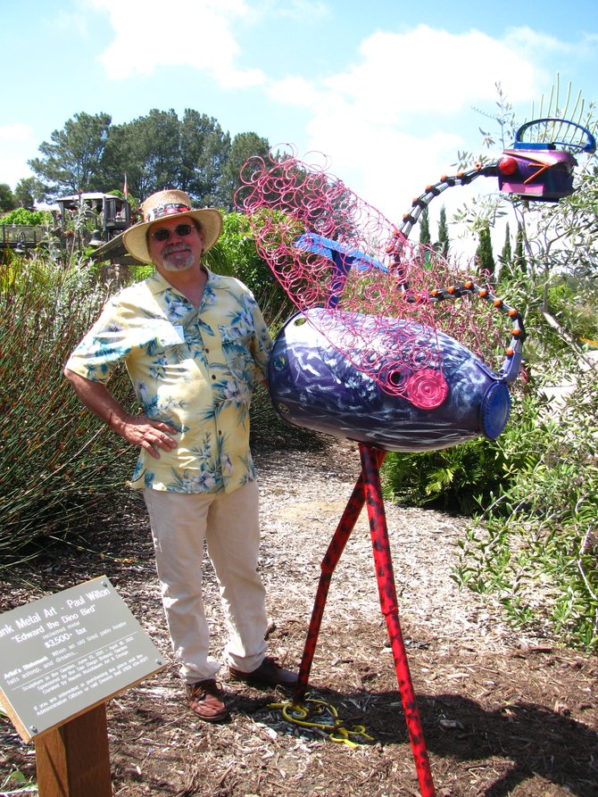 Paul Wilton and his sculpture "Edward the Dino Bird"