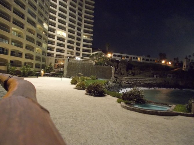 Las Olas's beach and pool and waterfall, by night