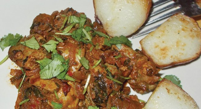 Kuchmachi is chicken liver fried with garlic, onions, cilantro, and herbs.