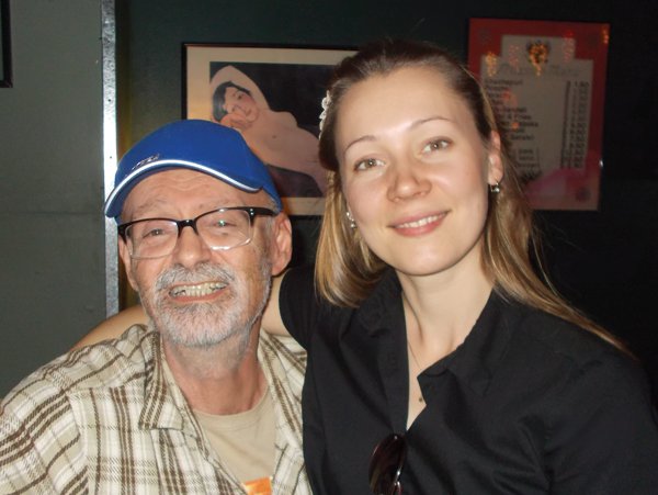 Owner Mark, from the Republic of Georgia, poses with server Marina, a former skating champion from Kazakhstan.
