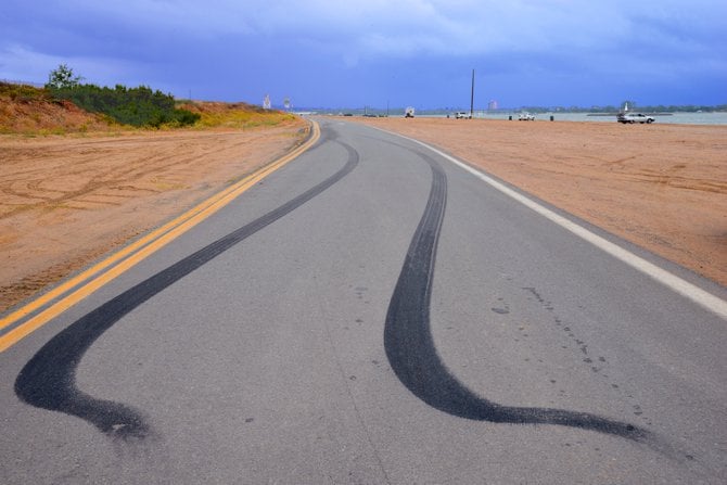 "Fast Getaway"
Photography by: Robert Chartier
Location: Fiesta Island, San Diego,  CA (Facing West)
I saw this burnout and had to capture it, good old school muscle car road scars:-)