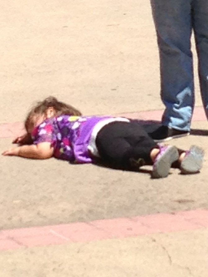 A very worn out child at Balboa Park San Diego