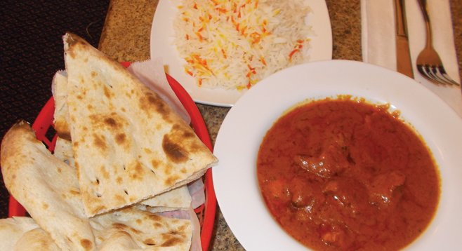 Naan bread (made in a 900-degree tandoor oven), rice, and chicken tikka masala.
