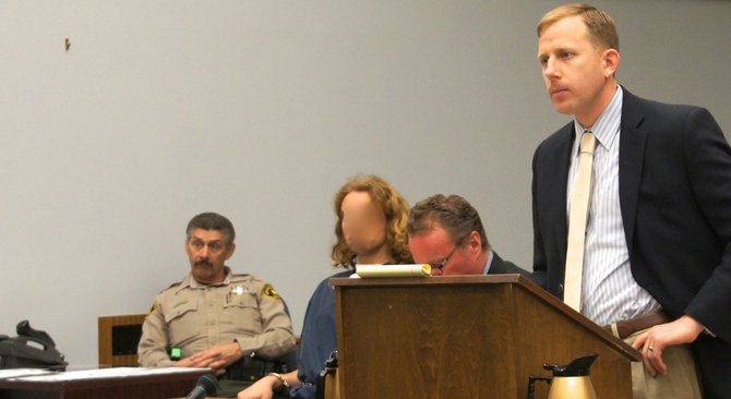 A diff judge ordered Craine's face obscured at the earlier hearing. Photo Weatherston.