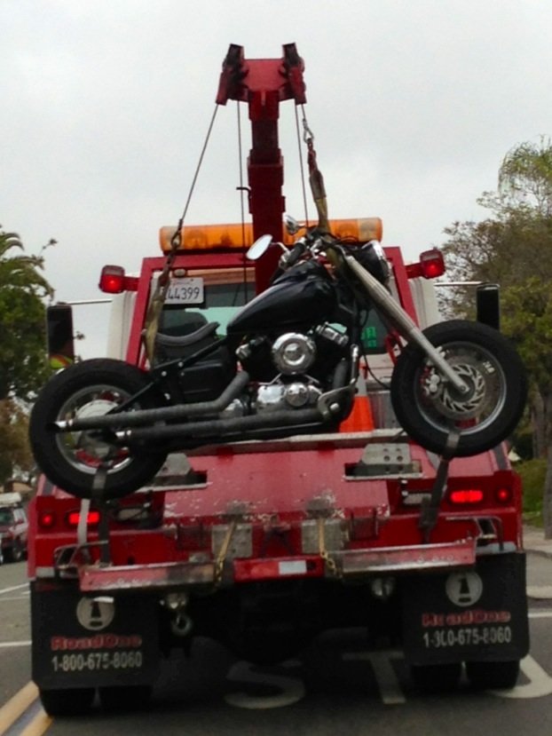 That's 1 way to tow a motorcycle going up broadway from downtown through Golden Hills