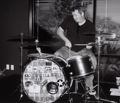 Michael Halloran playing Jeff Aafedt's (The Rugburns) drumset, in between songs at rehearsals for a closing medley at the 2000 San Diego Music Awards. Photo by Sandra Castillo.