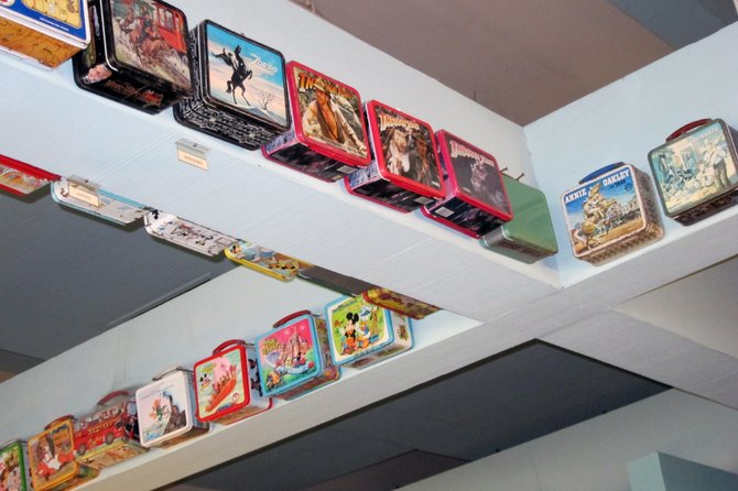 A collection of lunch boxes line the walls of the Apricot Tree Restaurant in Stockton, California.  