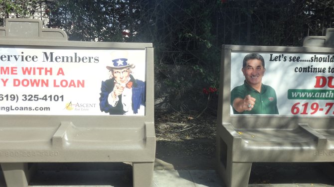 Two bus-bench ads vie for our attention along Park Blvd. in Balboa Park.
