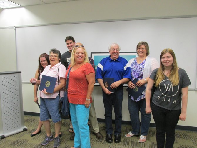 Award-winning photographers gathered at the Library's display of local scenes. Each participant received a declaration from Congressman Darrel Issa. 