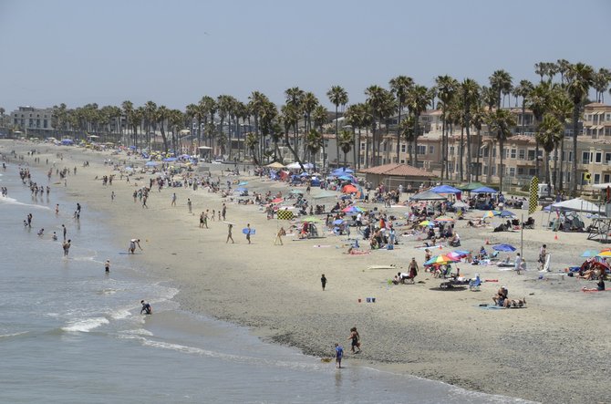 Crowds on Oceanside beach, just north of pier, June 22, 2013. Photo Weatherston.