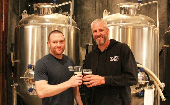 Thorn St. Brewery partners Dennis O'Connor (left) and Dan Carrico pose in their soon-to-be-expanded brewery.