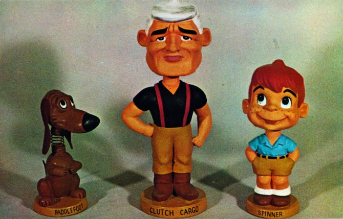 Prototypical bobble-heads. From a postcard dated 1959.