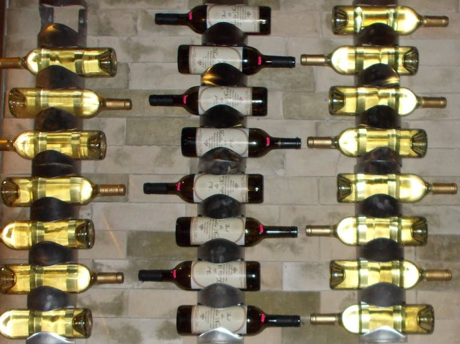 Wine bottles stored up counter wall