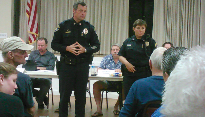 San Diego police Cpt. Andy Mills and Lt. Natalie Stone listen to the audience