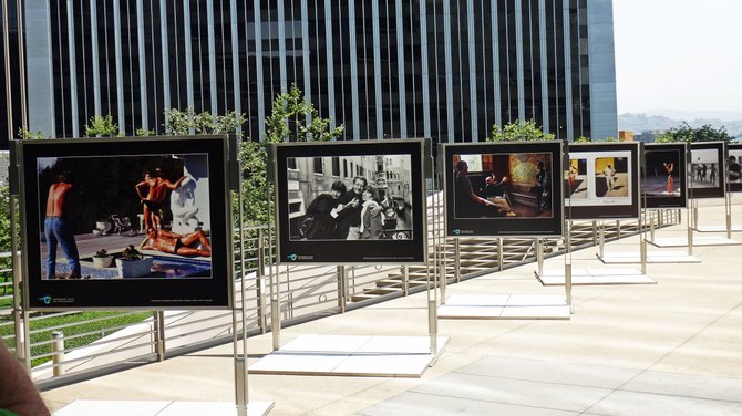 This was shot outside the Annenberg Space For Photography. No photos were allowed inside the exhibit building. In the second photo from left, photographer Helmut Newton is seen between two models.