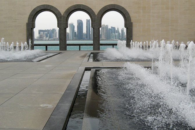 Doha, Qatar; Museum of Islamic Art with the modern part of Doha in the background