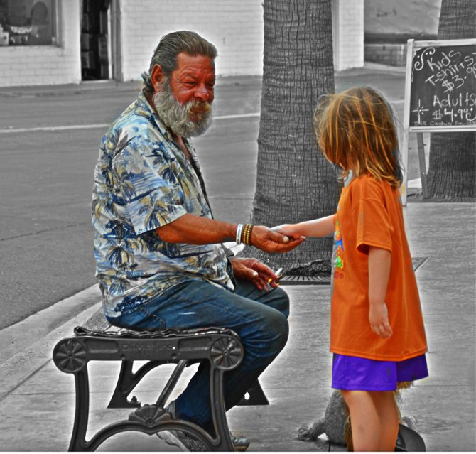 My son Fin, handing over the twenty-one cents he "found" in the cemetery...to someone who needs it more.