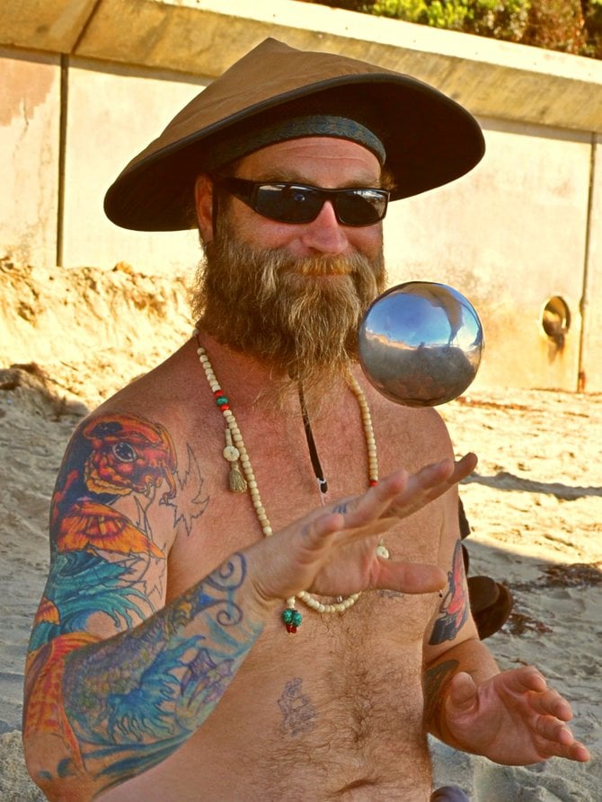 Scott Danger Stone shows off his mad skills with his shiny balls under the pier at O.B.