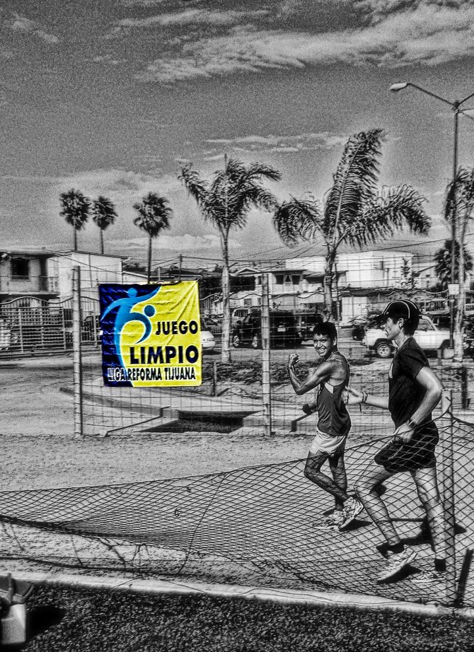 Neighborhood Photos
TIJUANA,BAJA CALIFORNIA
Racewalkers training in Reforma Sports Unit in Otay section of Tijuana,sign refers to: Fair Play/Marchistas entrenando en Unidad Reforma en Otay,Tijuana.