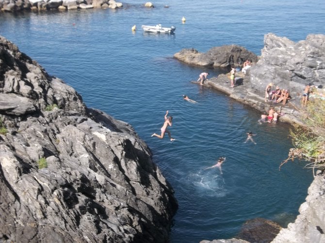 Kids cool off on a warm day in Cinque Terre, Italy