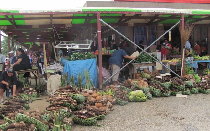 Vendors display local produce at a Tonga market.