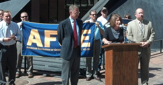 Rep. Susan Davis addresses media, flanked by Rep. Scott Peters (left), George McCubbin (right). Richard Barrera far left