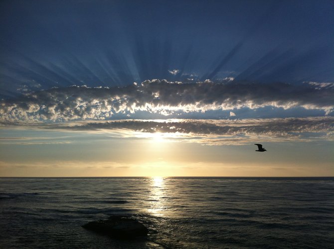 I was at a conference in La Jolla on Ocean Street, visiting from AZ on 8/21/13.  I captured the amazing rays of the sunset over the water.  It truly is remarkable what the lens of a camera can do. 