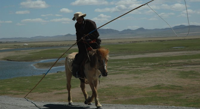 Horseman, Mongolia. Typical sight on the Trans-Mongolian train.  