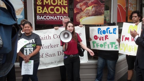 Debra Flores, a Wendy's employee participating in the one-day strike, addresses the crowd