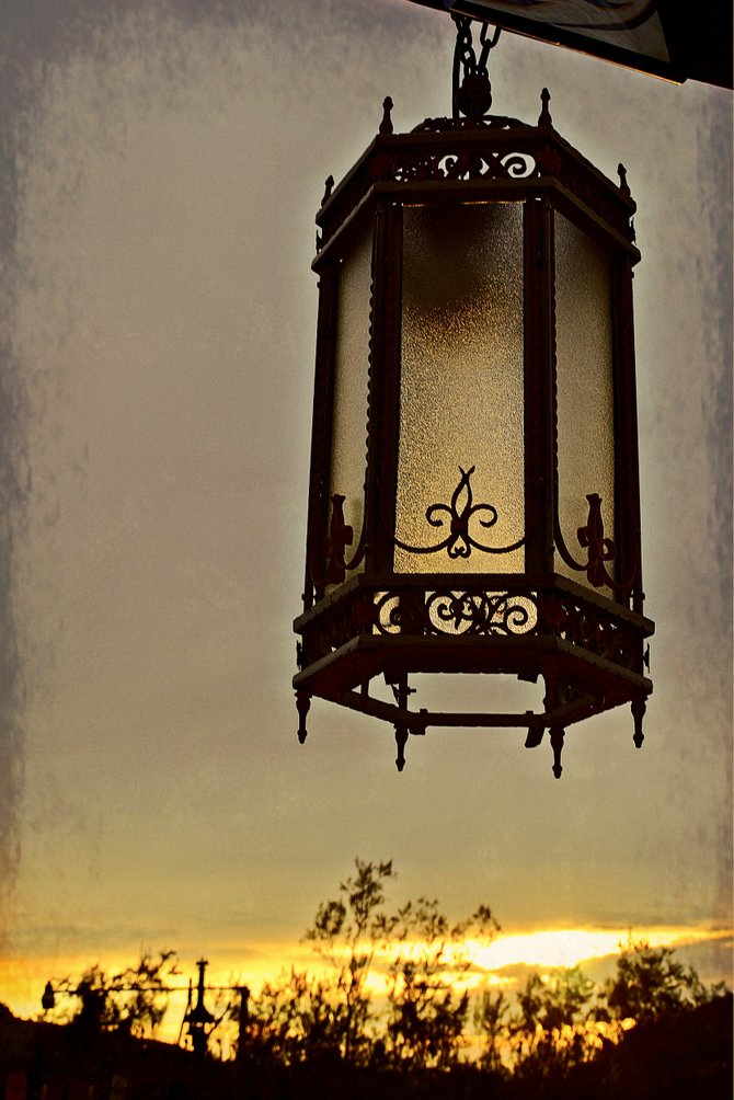 vintage lantern at Greaseland Flat near Pinnacle Peak, against the backdrop of an Arizona sunset