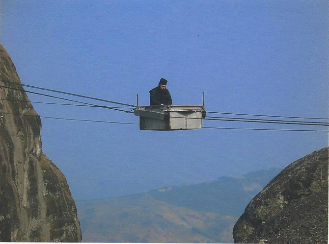 Monk in cable car, Meteoras. 