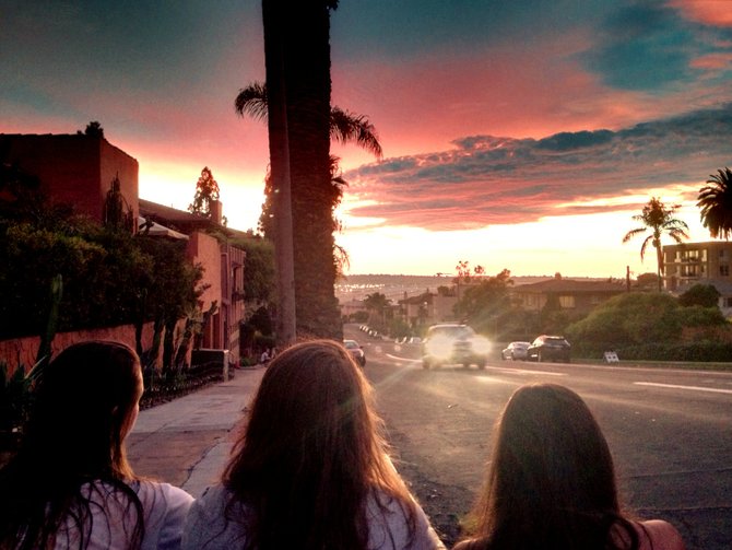 Three Park West teenage girls admiring the sunset over the San Diego Airport and Downtown on Front and Laurel.  I wish I could send this to them personally. 