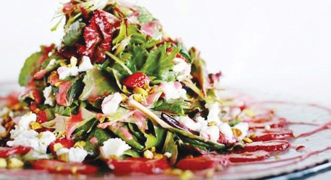 Cafe 21’s strawberry salad (pistachios and goat cheese tossed with crisp greens and a light raspberry vinaigrette) delighted Mary Beth Abate.