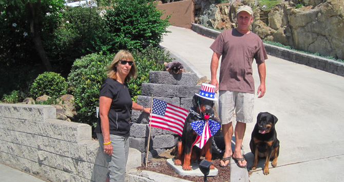 Janet Mika, Rick Albin, and Gracie the rottweiler with Madra Dog