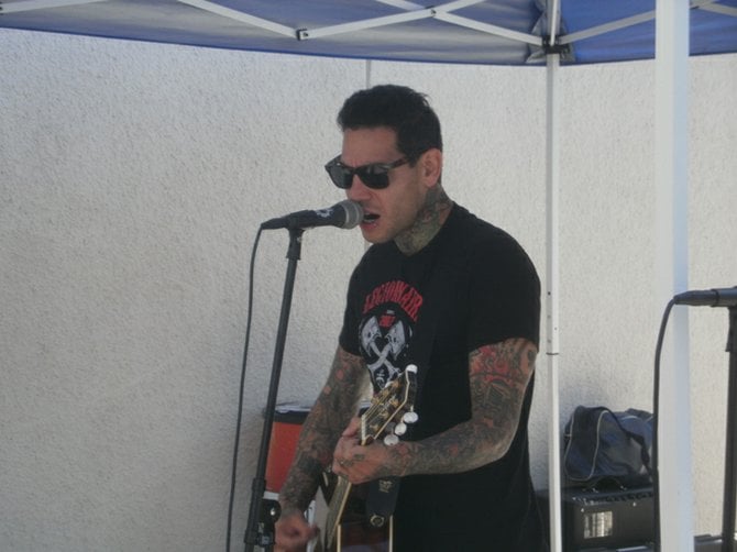 MXPX frontman Mike Herrera was in acoustic mode for his pool side set. Photo by Bart Mendoza.