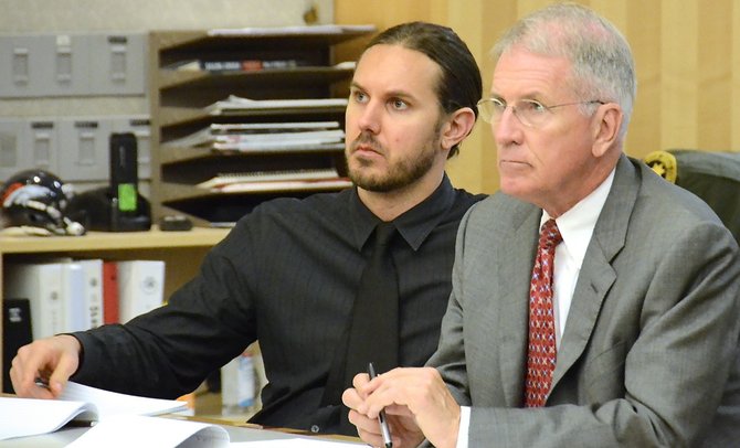 Tim Lambesis and attorney hear testimony f the fake hitman. Photo Weatherston.