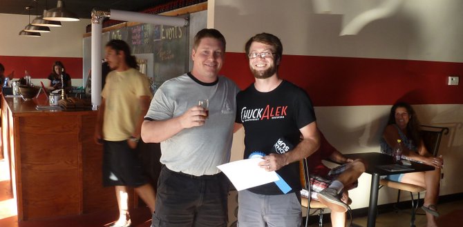 Winning homebrewer Travis Hammond (left) and ChuckAlek owner and brewer Grant Fraley