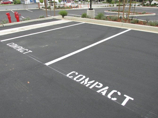 A newly remodeled parking lot in Carlsbad, which still allows developers to use the ridiculous "compact" sized spaces. 
