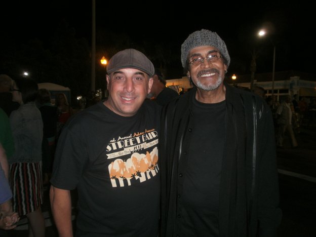 One of the Adams Avenue Street Fair bookers, Steve Kader with Love guitarist Johnny Echols. Photo by Bart Mendoza. 