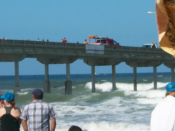 Lifeguard truck on Ocean Beach Pier watching the Paddle Around the Pier event.