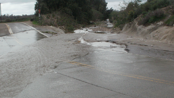 Monument Road gets washed out easily due to poor drainage in the Tijuana River Valley.