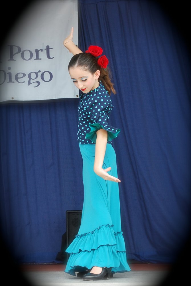 Young flamenco dancer, 11, gracefully moves her hands and rhythmically taps her feet at the Festival of Sail downtown.  Danzarts.org