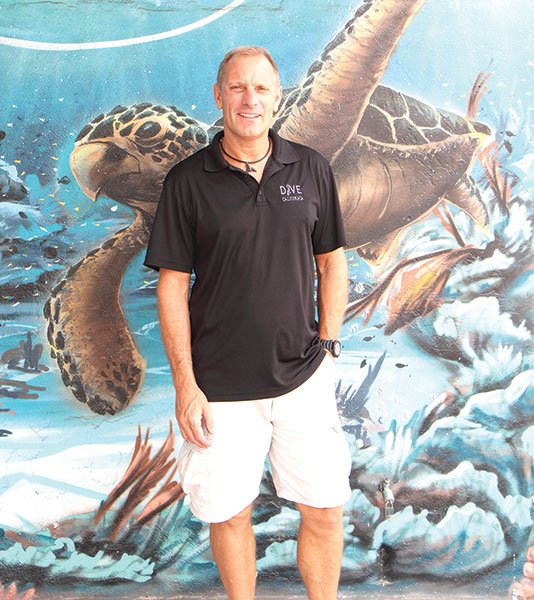 Michael Timm in front of his Sports Arena Blvd. scuba shop, Dive California.