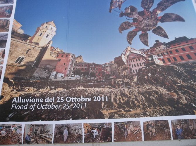 Pictures of the 2011 flood greet visitors to Vernazza. 