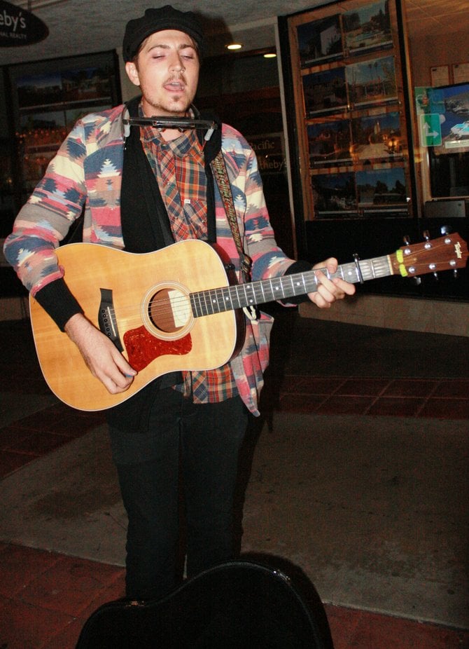 Adam Sisco  in a women's Aztec print jacket