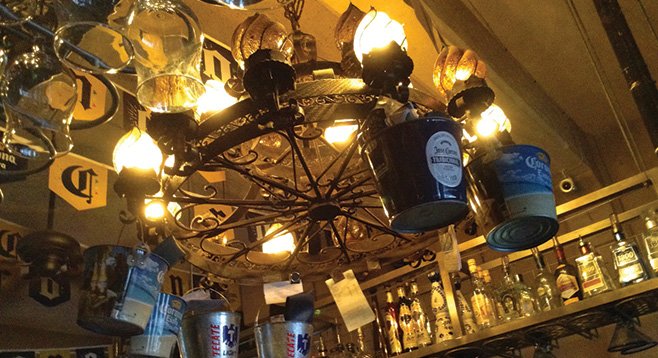 Ice buckets hang from the big wrought-iron chandelier.