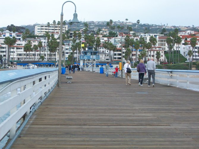 Walking along and enjoying the fresh air on the San Clemente Pier.