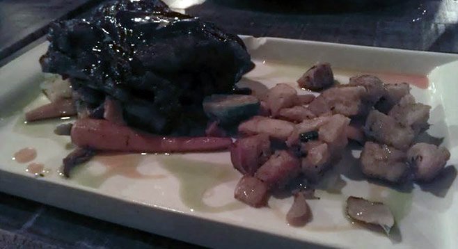 Plate of ribs with an artsy filter applied.  American Voodoo is very dark...perhaps to thwart Instagramers and bloggers?