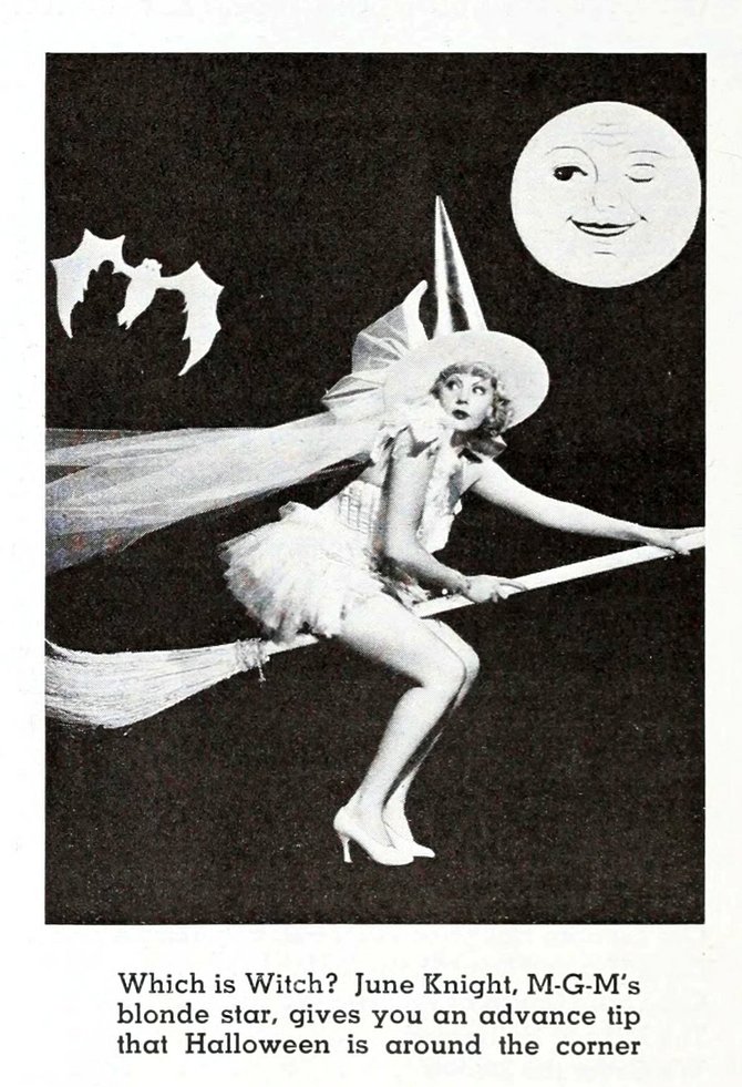 It's only a paper moon winking at the bewitching June Knight.